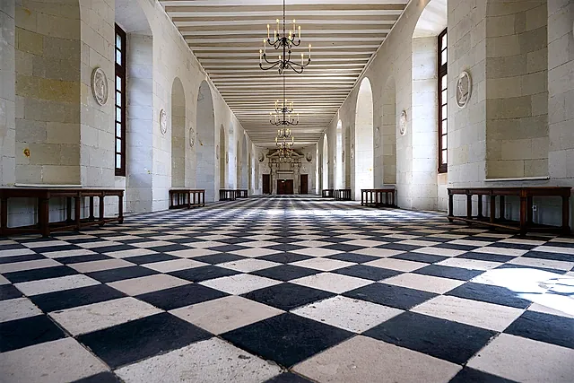 The black-and-white tiled floor of the long gallery inside Château de Chenonceau